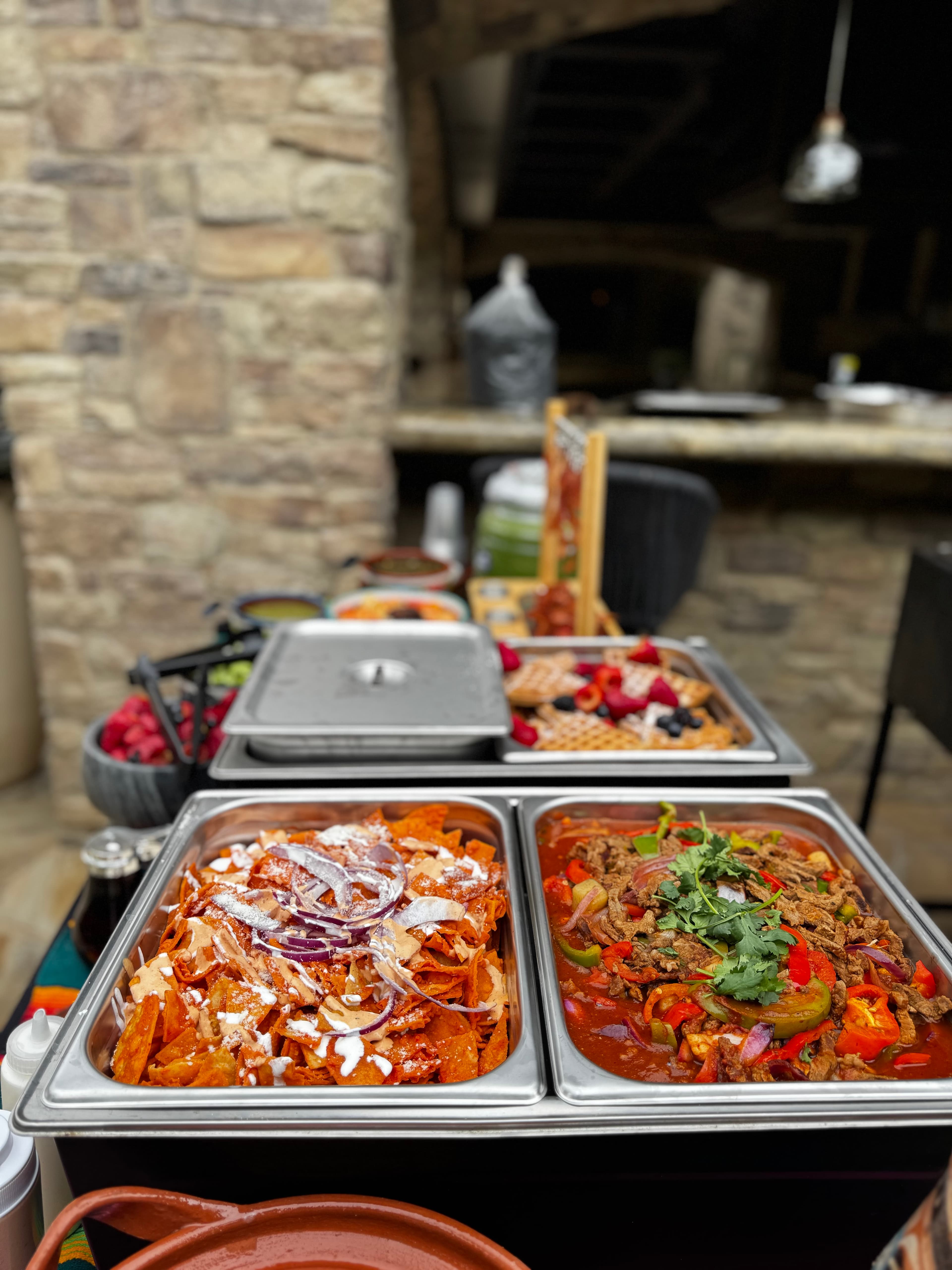 Corporate breakfast buffet with chilaquiles, waffles, and hot entrees